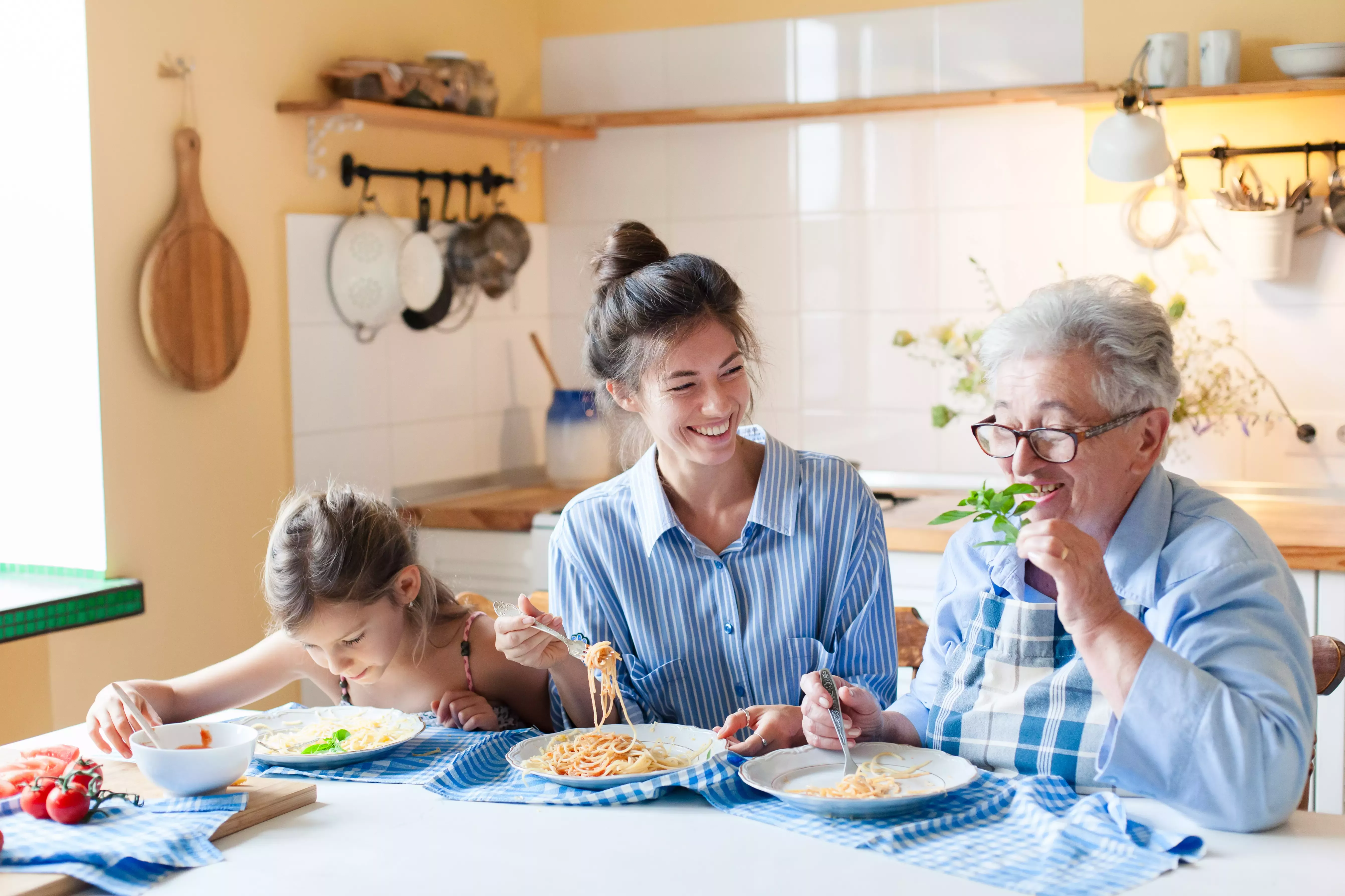 Family sharing a meal together at home around a kitchen table